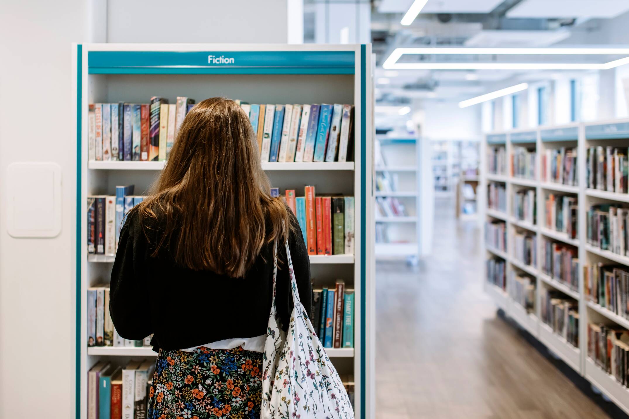 A student exploring the library