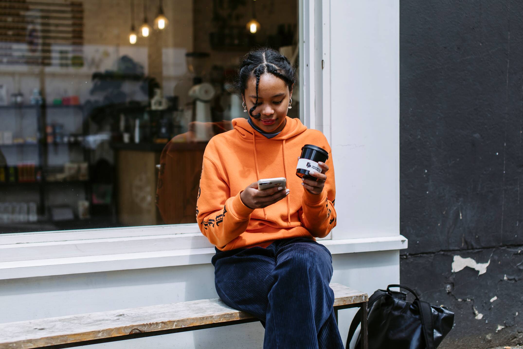 Student on their phone outside
