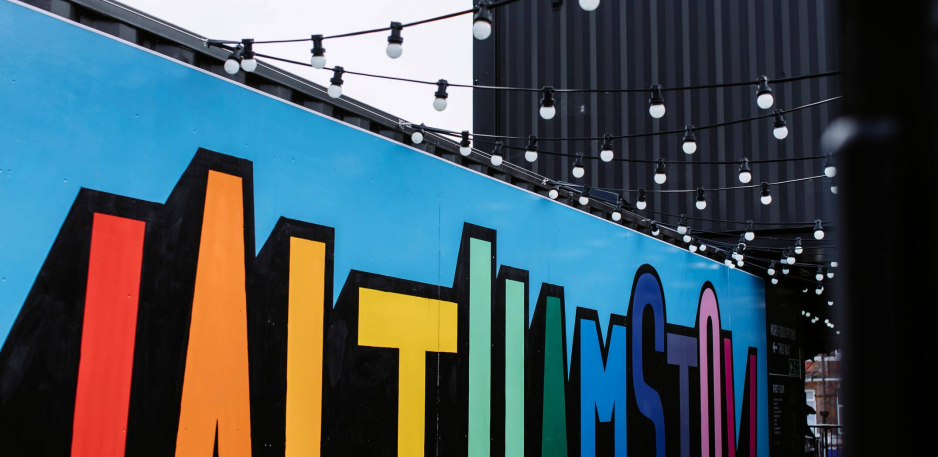 Text art on a venue made from containers