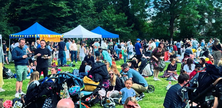 lots of people sitting in a field