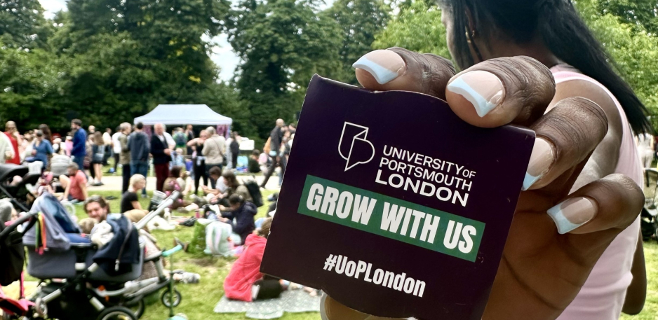 girl holding university pad/book